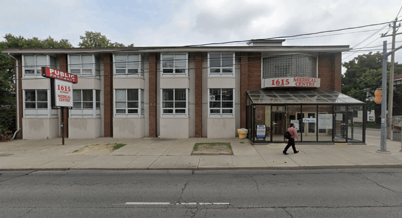 A man walks by 1615 Dufferin St.